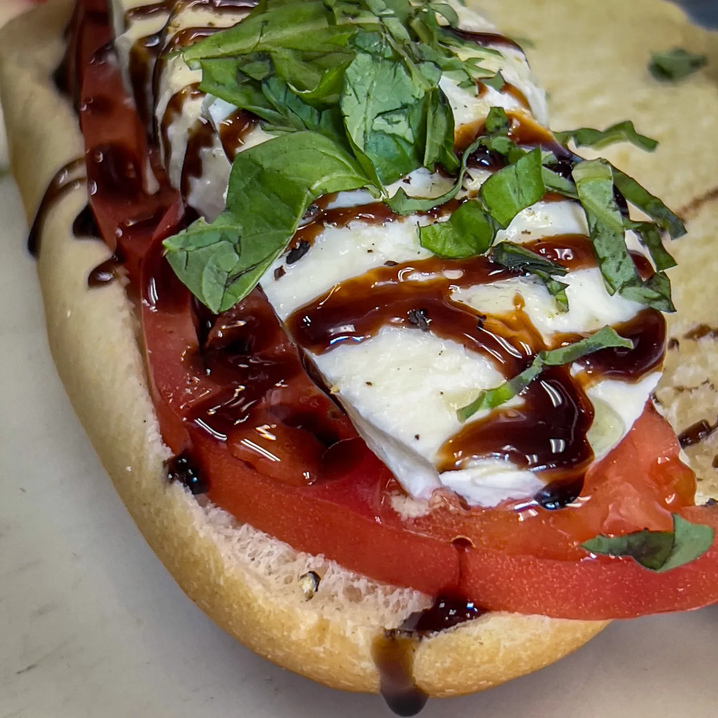 Bruschetta Siciliana with melted mozzarella, tomato and basil
