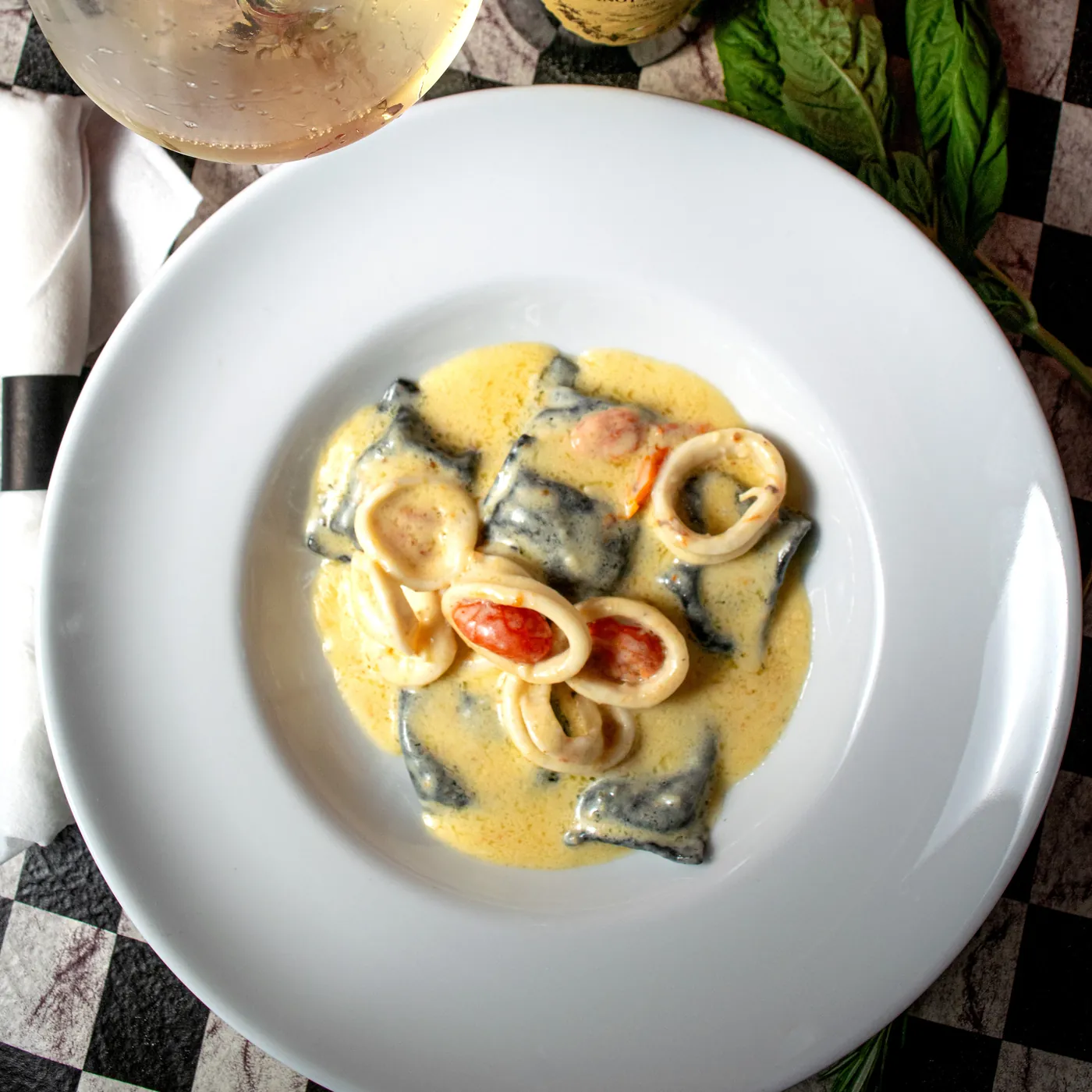 Black squid ink pasta with calamari in a cream sauce