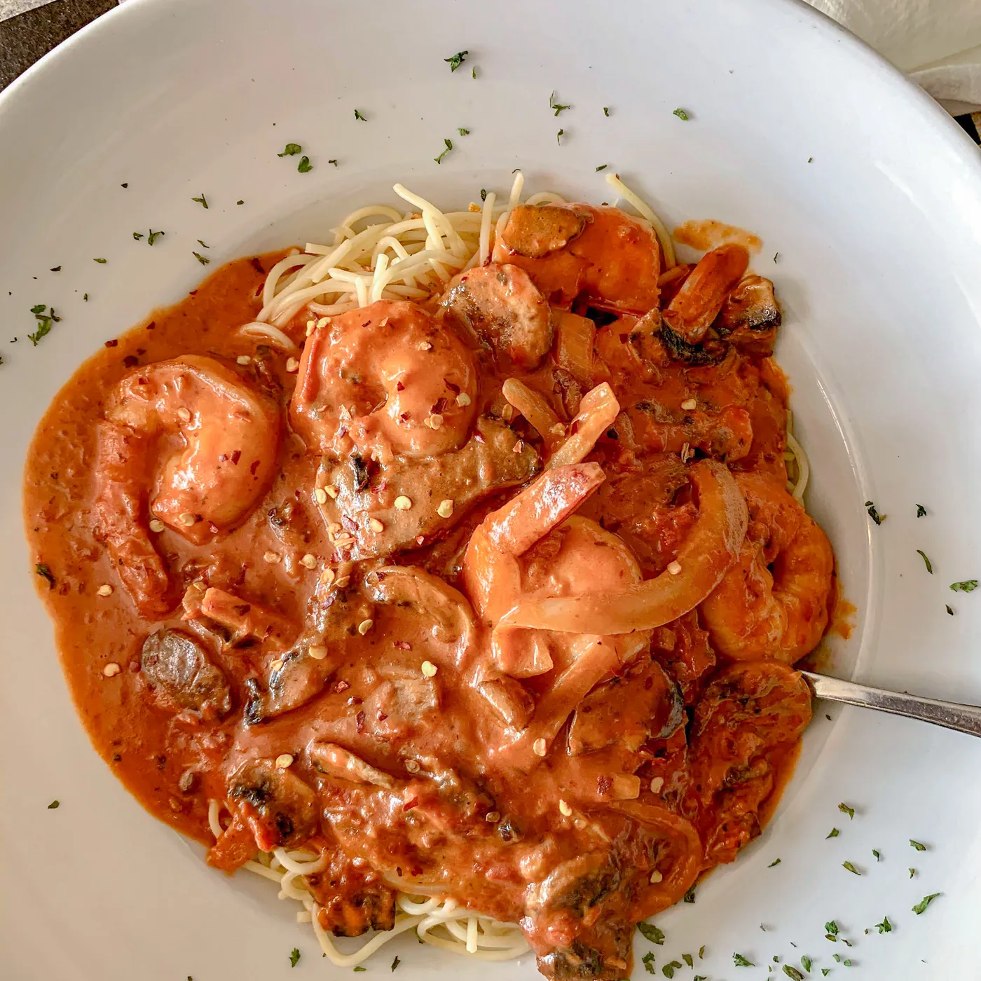 Shrimp in pink sauce over spaghetti